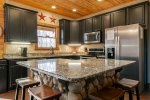 Fully Equipped Kitchen with Granite Countertops & Large Island